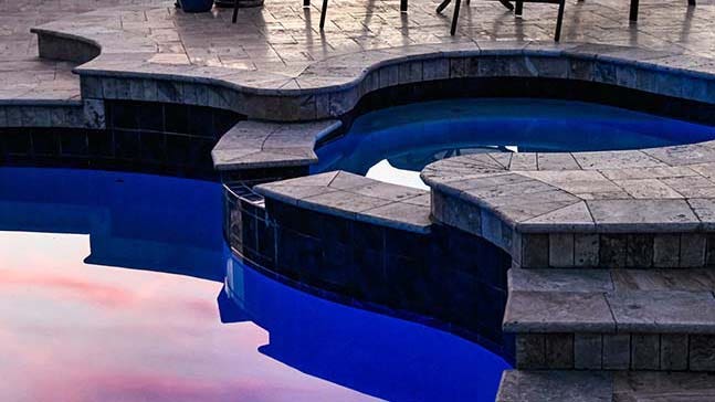 A pool with a spa